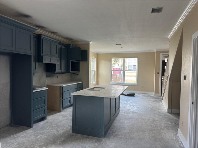807 S Coulter Dr, Bryan, TX 77803 - kitchen featuring ornamental molding, a kitchen island, and concrete flooring