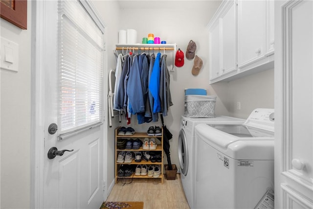 1713 Cardinal Ln, College Station, TX 77845 - laundry area with washer and clothes dryer, cabinet space, and baseboards