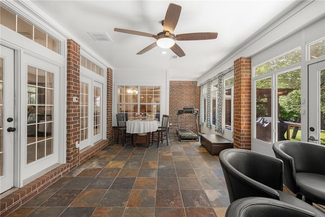 1713 Cardinal Ln, College Station, TX 77845 - sunroom with french doors, stone finish floors, and brick wall
