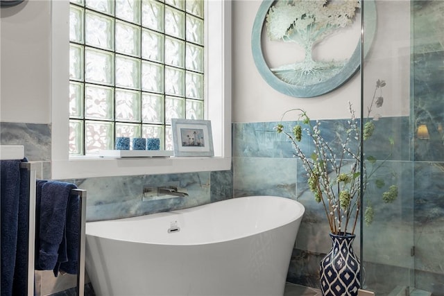 1713 Cardinal Ln, College Station, TX 77845 - full bath featuring a freestanding bath, tile walls, and vanity