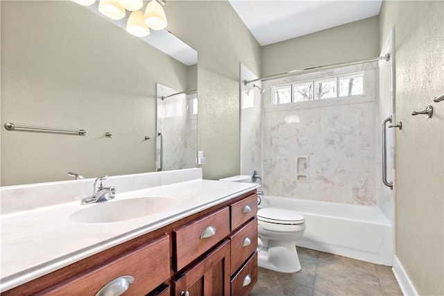 bathroom featuring tile patterned floors, toilet, vanity, and bathtub / shower combination