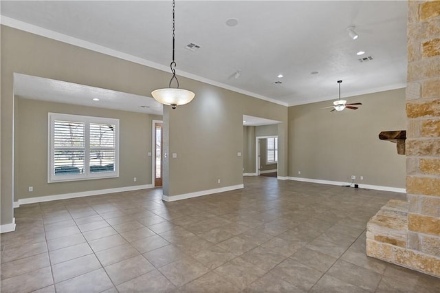 unfurnished living room with ceiling fan, visible vents, baseboards, and ornamental molding