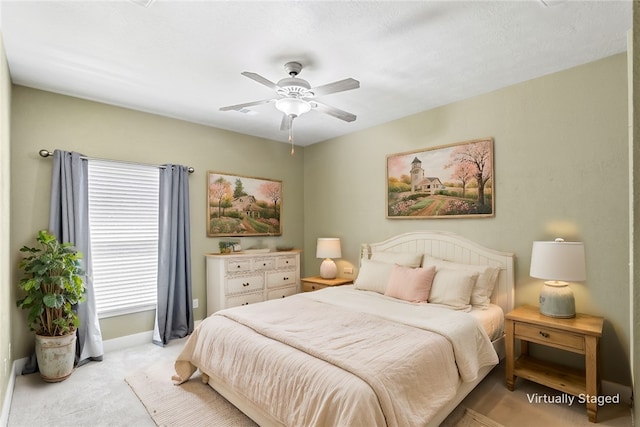 bedroom with carpet flooring, baseboards, and ceiling fan