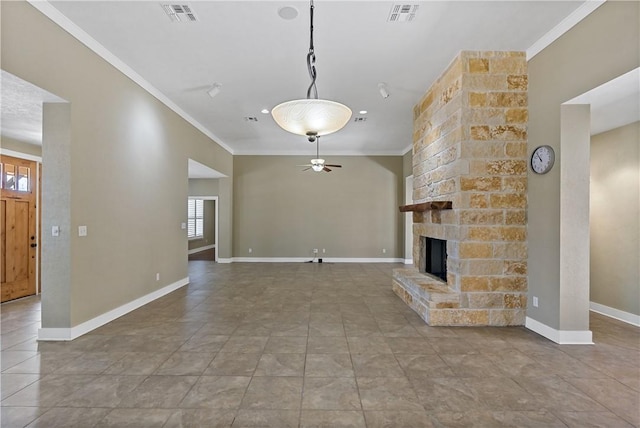 unfurnished living room with visible vents, crown molding, a large fireplace, and baseboards