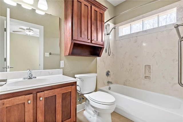 bathroom with tile patterned floors, toilet, a ceiling fan, shower / tub combination, and vanity