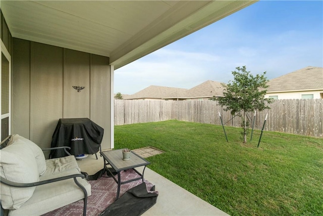 view of yard with a patio area and a fenced backyard