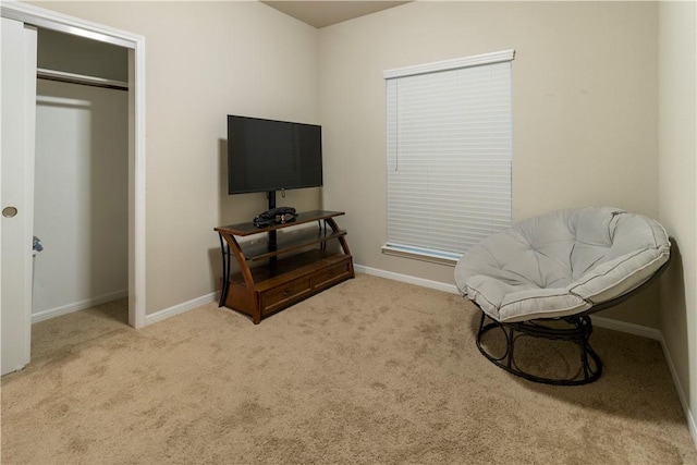sitting room with carpet flooring and baseboards