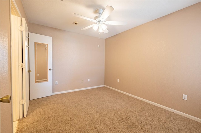 519 SW Pkwy Unit 203, College Station, TX 77840 - empty room featuring light carpet, ceiling fan, a smoke detector, and baseboards