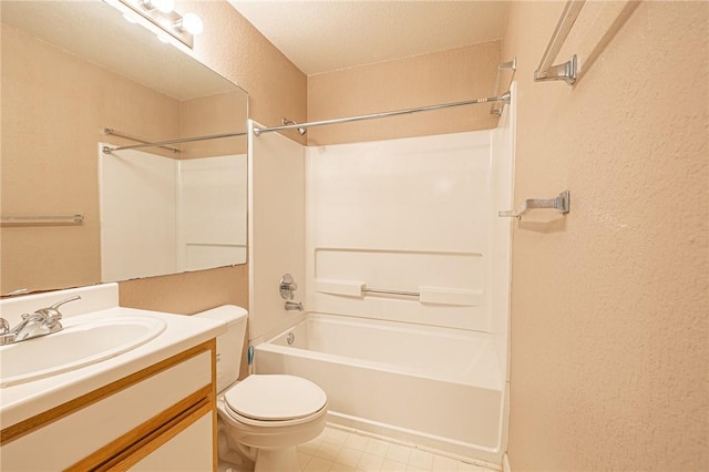 519 SW Pkwy Unit 203, College Station, TX 77840 - bathroom featuring a textured wall, toilet, vanity, and shower / bathtub combination