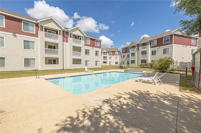 519 SW Pkwy Unit 203, College Station, TX 77840 - community pool featuring a residential view and a patio area