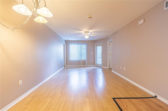 519 SW Pkwy Unit 203, College Station, TX 77840 - empty room featuring light wood-style floors, baseboards, and a ceiling fan