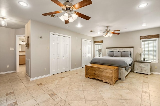 2355 Jackson League Cir, Brenham, TX 77337 - bedroom with light tile patterned flooring, baseboards, two closets, recessed lighting, and a ceiling fan