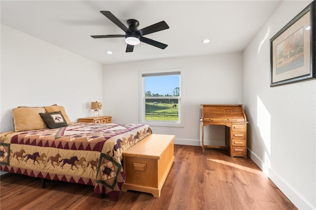 2355 Jackson League Cir, Brenham, TX 77337 - bedroom featuring wood finished floors, recessed lighting, baseboards, and a ceiling fan
