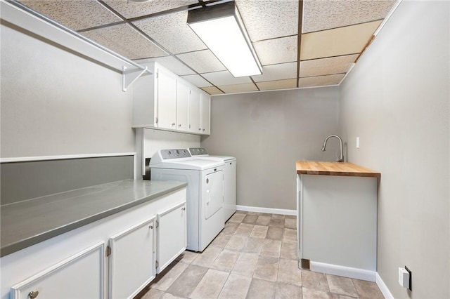 2355 Jackson League Cir, Brenham, TX 77337 - laundry area with washing machine and dryer, cabinet space, and baseboards