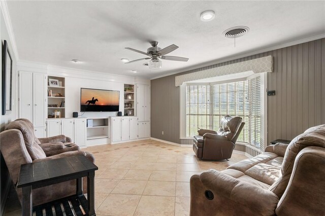 2355 Jackson League Cir, Brenham, TX 77337 - living room featuring crown molding, built in features, light tile patterned floors, ceiling fan, and baseboards