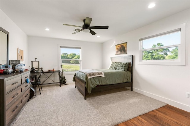 2355 Jackson League Cir, Brenham, TX 77337 - bedroom with multiple windows, light wood-style floors, recessed lighting, baseboards, and a ceiling fan