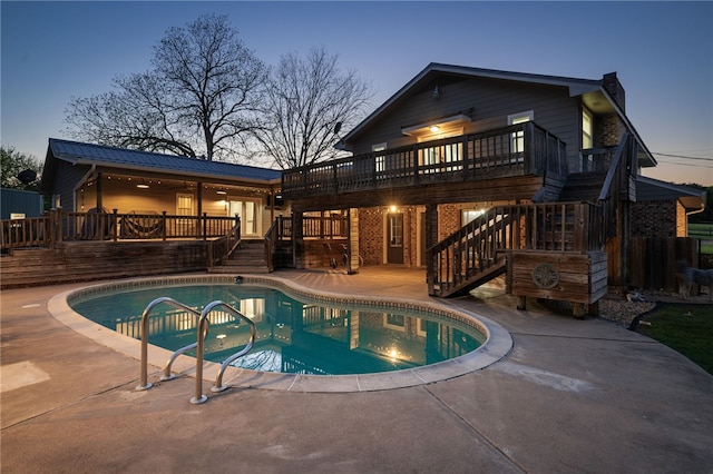 2355 Jackson League Cir, Brenham, TX 77337 - rear view of house with stairs, a wooden deck, a patio area, and metal roof