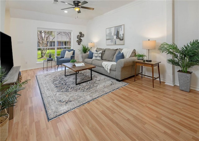 living room featuring a ceiling fan, recessed lighting, wood finished floors, and baseboards