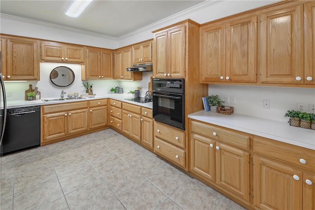 kitchen featuring black appliances, a sink, under cabinet range hood, crown molding, and light countertops