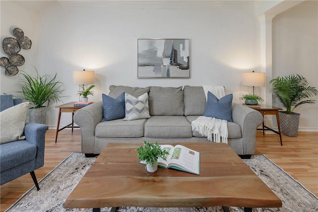 living room with baseboards and wood finished floors