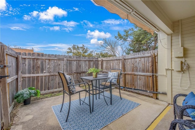 view of patio / terrace featuring outdoor dining space and a fenced backyard