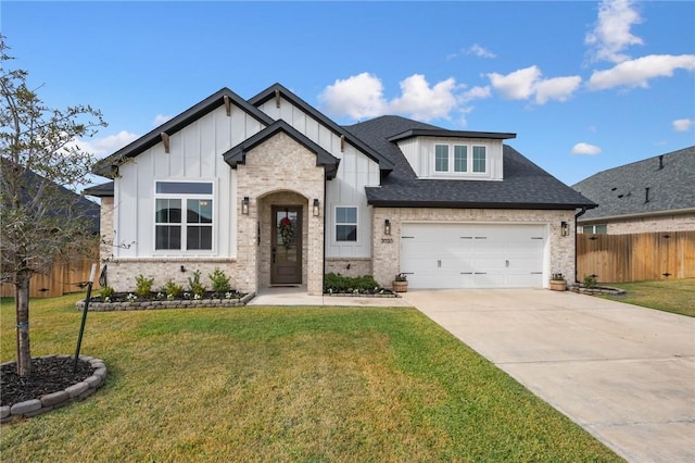 view of front of house featuring a front lawn and a garage