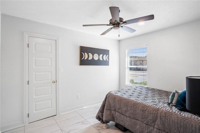 3004 Woodville Rd, Bryan, TX 77803 - bedroom with light marble finish floors, ceiling fan, and baseboards
