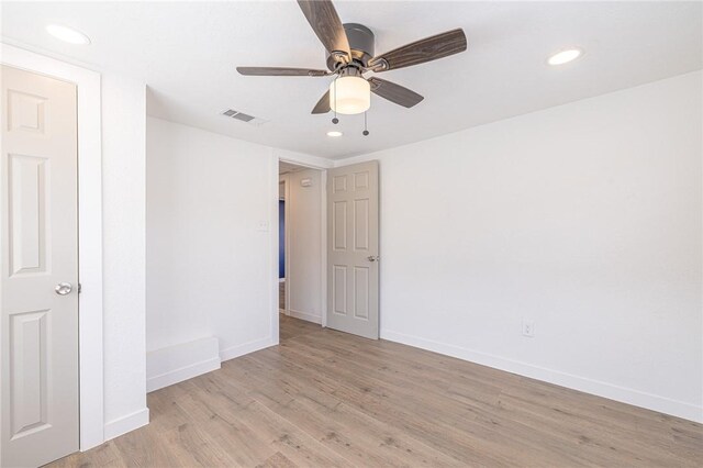 empty room featuring light hardwood / wood-style flooring and ceiling fan