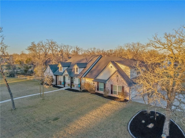 new england style home with a front yard