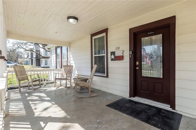 property entrance featuring covered porch