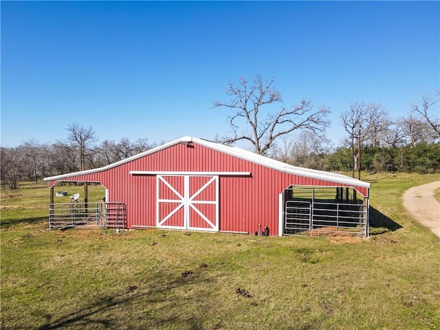 22349 Fm 359th Rd, Hempstead, TX 77445 - view of pole building with a lawn and an exterior structure