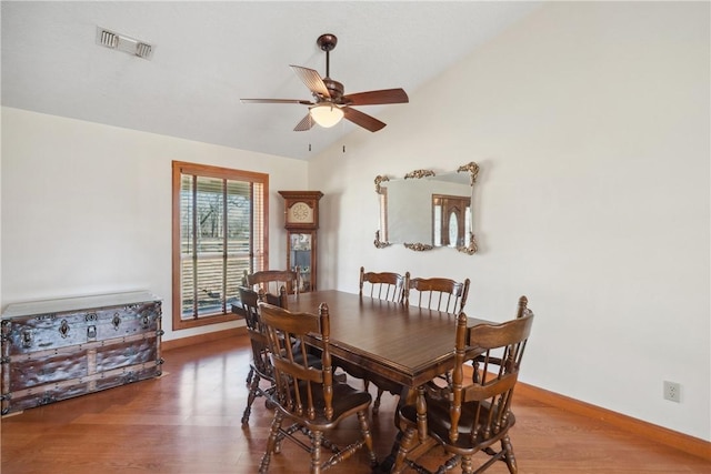 22349 Fm 359th Rd, Hempstead, TX 77445 - dining space featuring vaulted ceiling, a ceiling fan, wood finished floors, and baseboards