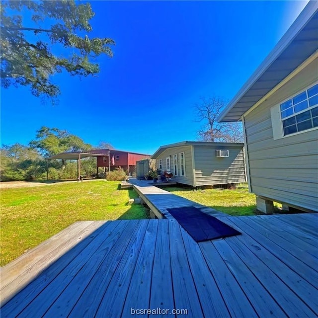 wooden deck with an AC wall unit and a lawn