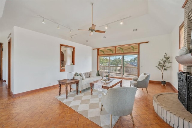 living room featuring light parquet flooring and ceiling fan