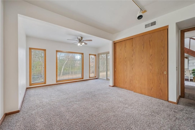 interior space featuring a healthy amount of sunlight and ceiling fan