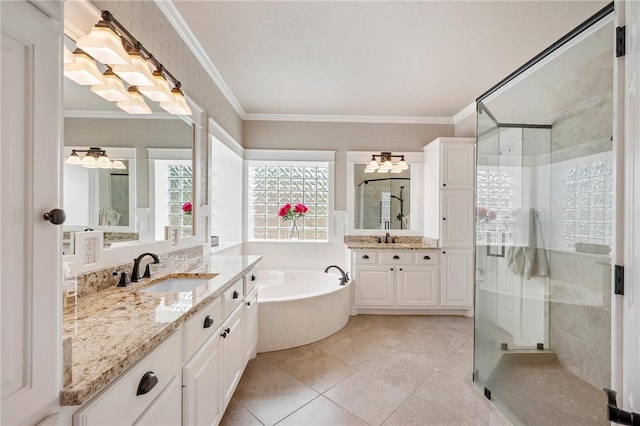 bathroom with a sink, a bath, a shower stall, and ornamental molding