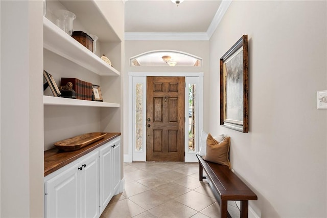 interior space featuring crown molding and light tile patterned floors