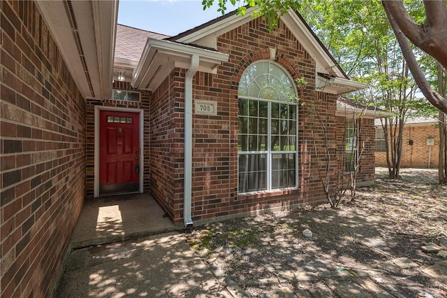 705 Summerglen Dr, College Station, TX 77840 - property entrance with brick siding and roof with shingles