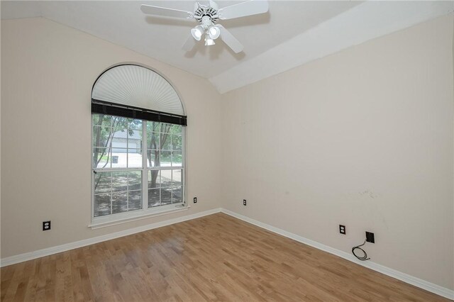 705 Summerglen Dr, College Station, TX 77840 - unfurnished room featuring lofted ceiling, wood finished floors, and a ceiling fan