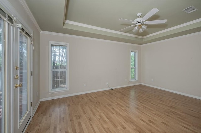 705 Summerglen Dr, College Station, TX 77840 - unfurnished room with a tray ceiling, light wood-style floors, crown molding, and ceiling fan