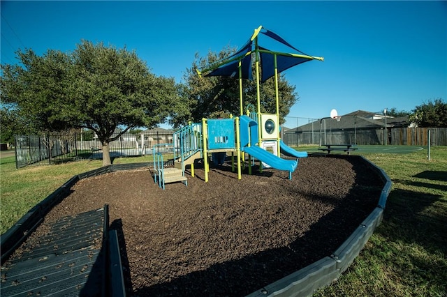 view of playground with a lawn