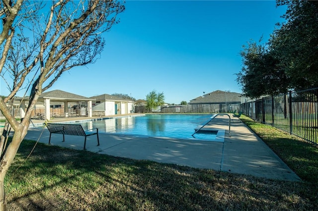 view of swimming pool with a patio