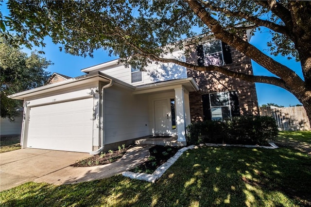 ranch-style home with a front lawn and a garage