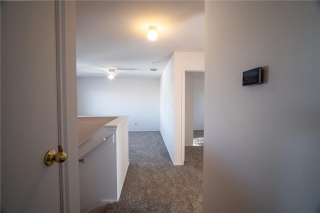 hallway with carpet flooring