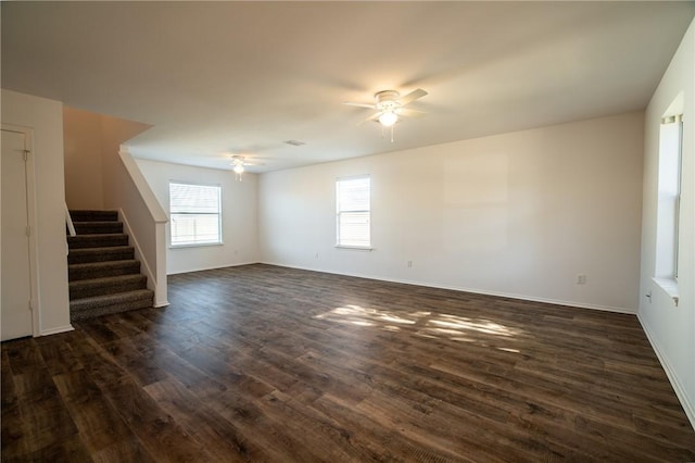 interior space featuring ceiling fan and dark hardwood / wood-style floors