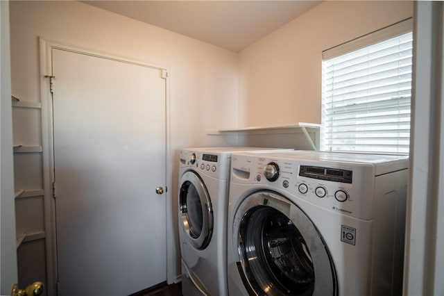 clothes washing area with independent washer and dryer