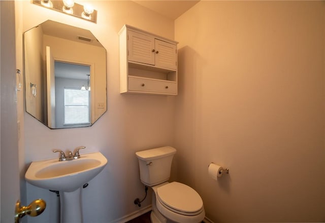 bathroom featuring sink and toilet