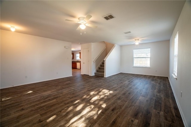 interior space featuring ceiling fan and dark hardwood / wood-style flooring