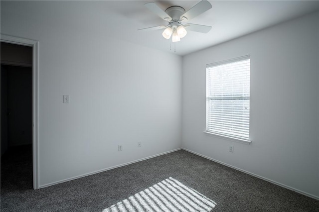 carpeted empty room with ceiling fan