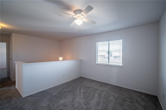 carpeted empty room featuring ceiling fan